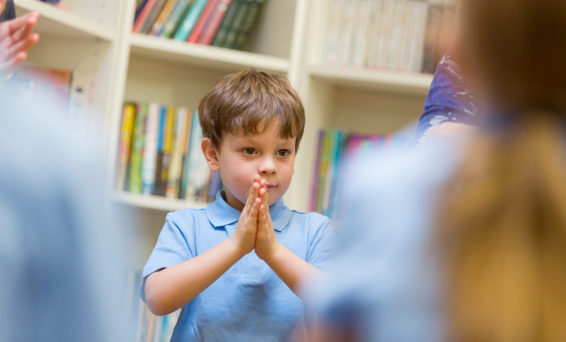 School child prayer pose