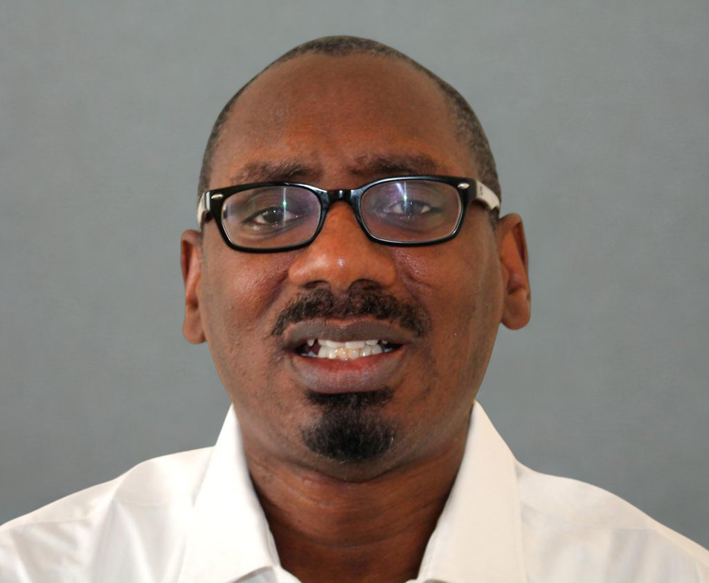 Ricard Reddie warm grey background