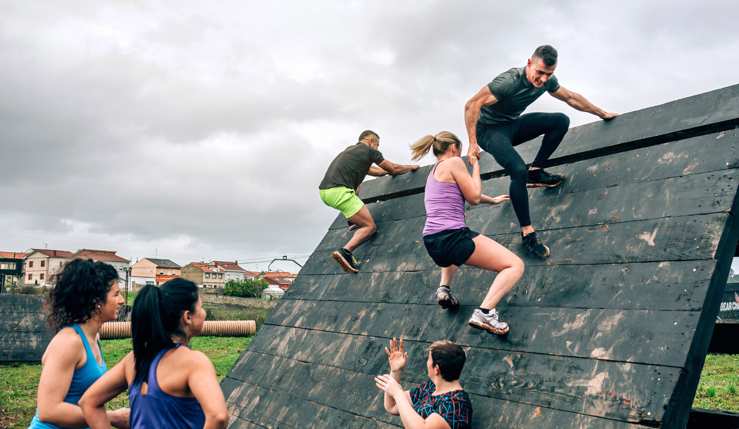 Adults on obstacle course
