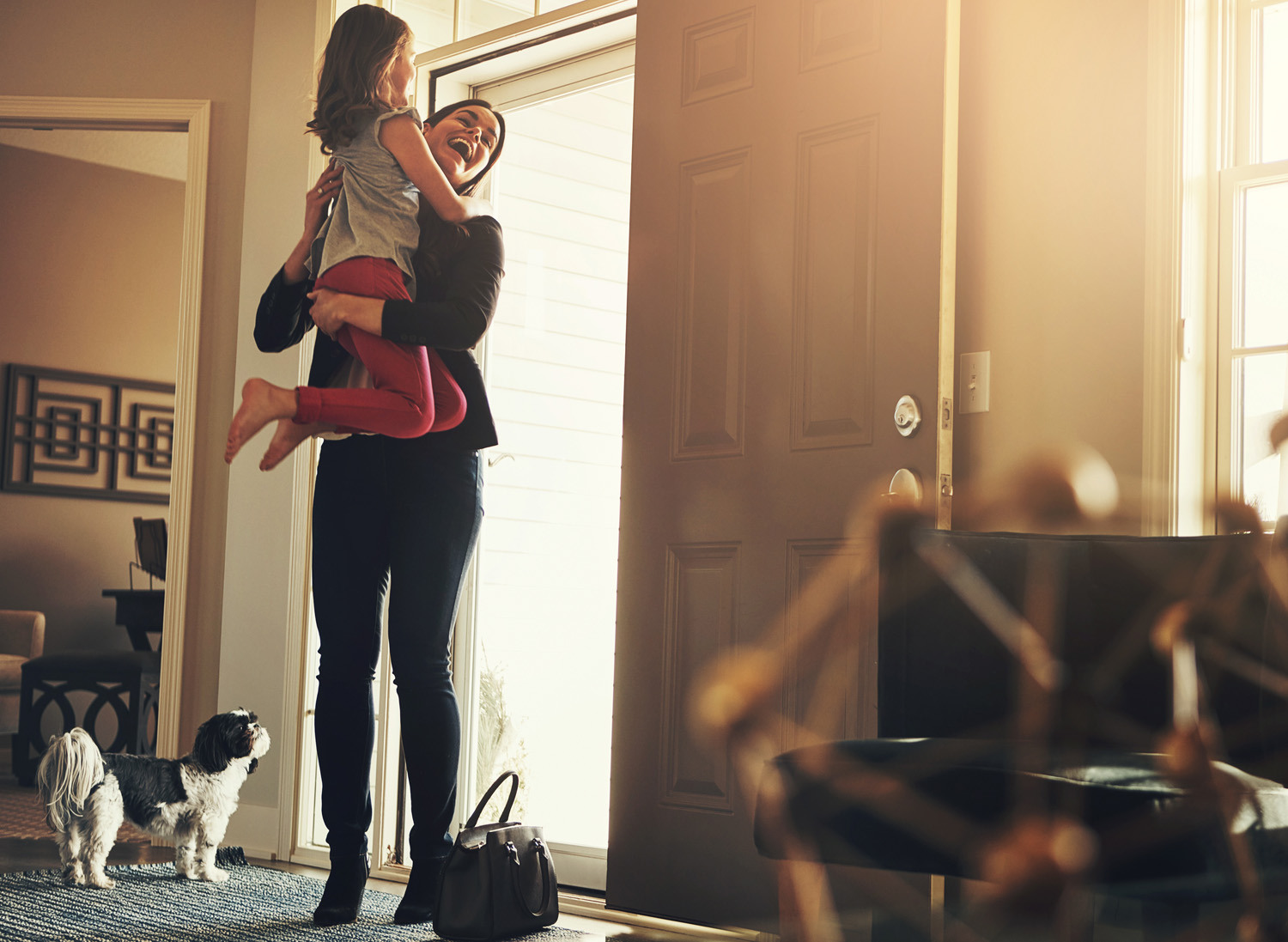 Girl joyfully welcomes mother