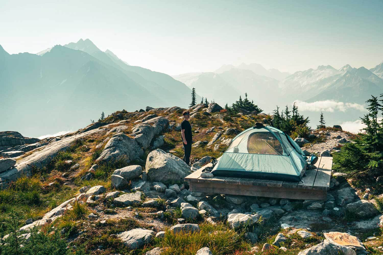Man with tent in mountains