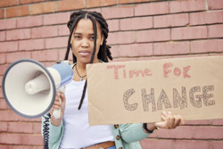 Teenage girl with megaphone placard 250px