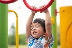 Toddler on climbing frame 250px
