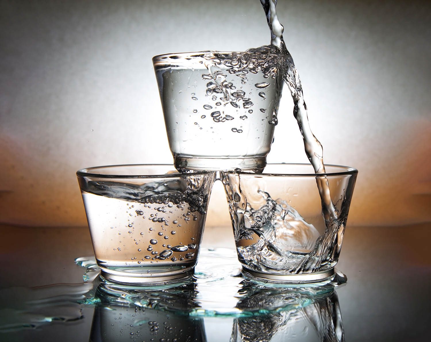 Water cascading into glasses