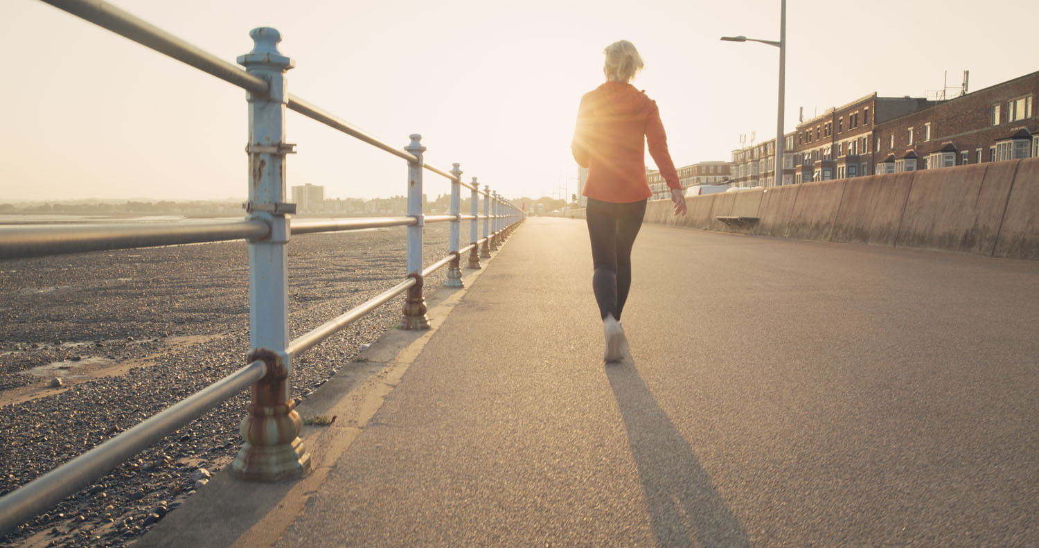 Woman walking on promenade